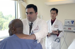 Doctor examines patient