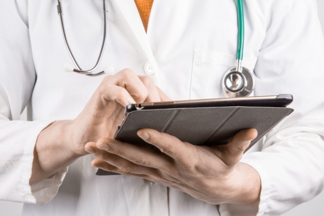 Doctor holding tablet pc - New Diabetic Neuropathy Guidelines for Doctors