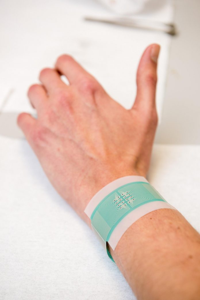 The patch can be attached to the wrist to measure blood glucose without piercing the skin
